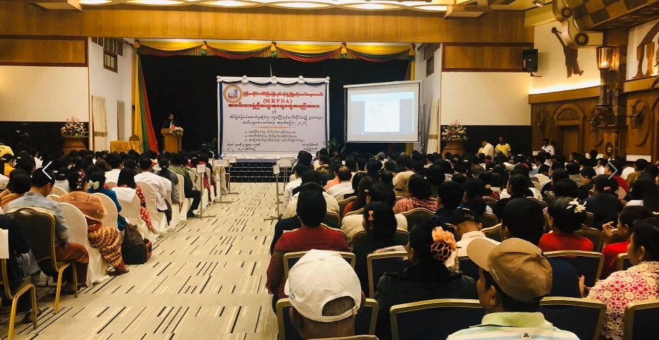 Nay Pyi Taw awareness seminar and delegation banner.